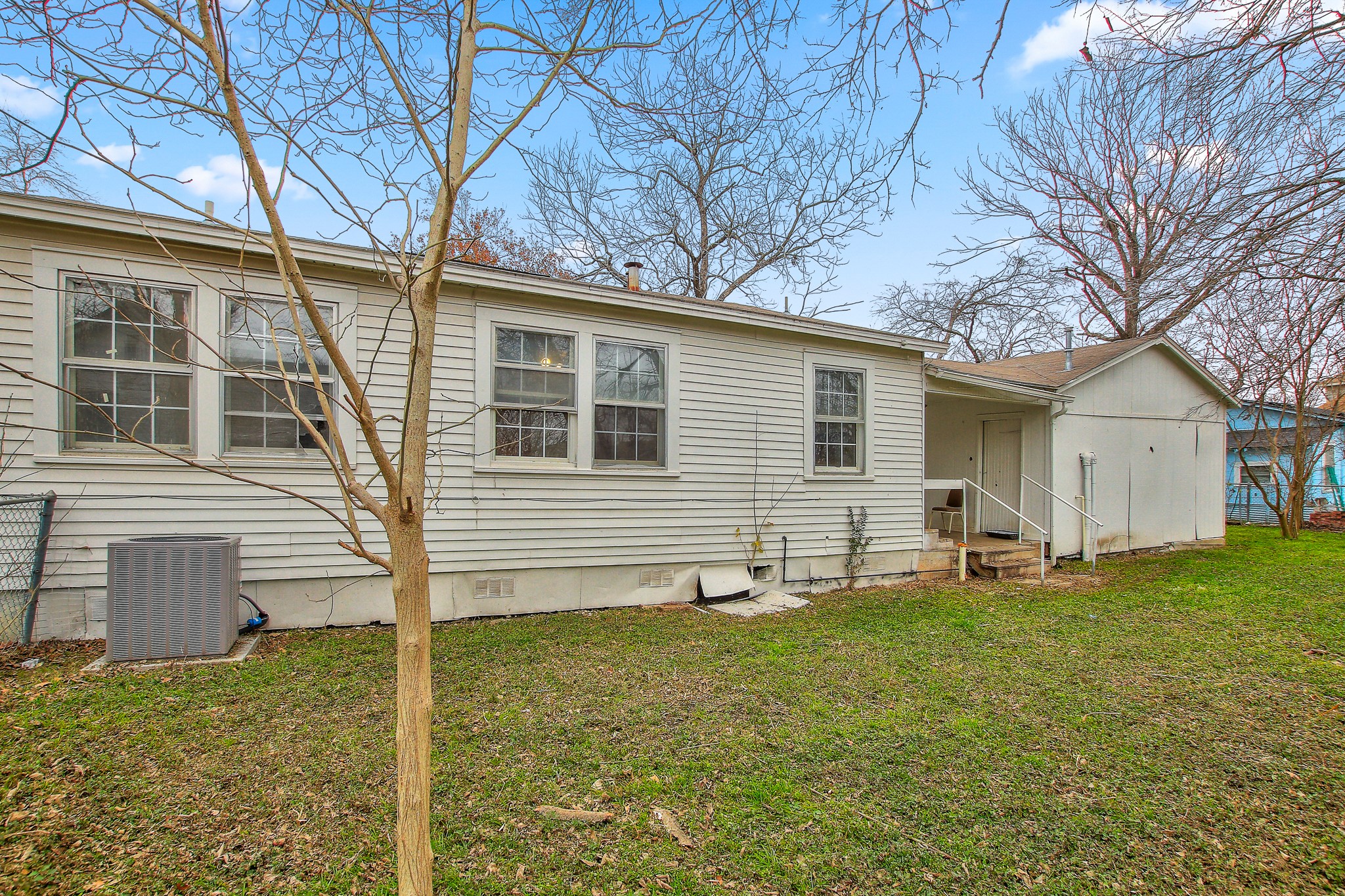 921 West 5th Street Taylor, TX 76574 - Photo 29 of 29 a front view of a house with a yard and trees