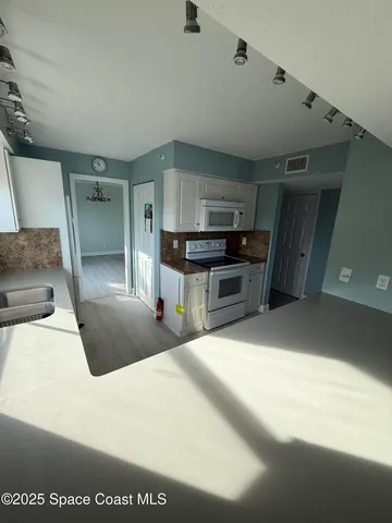 a view of a kitchen with a sink