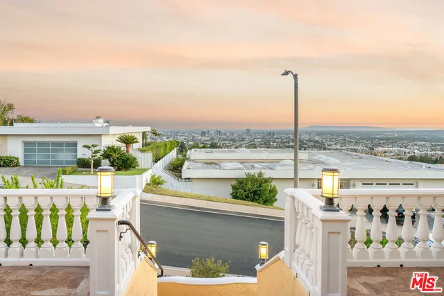 a view of a balcony with city view