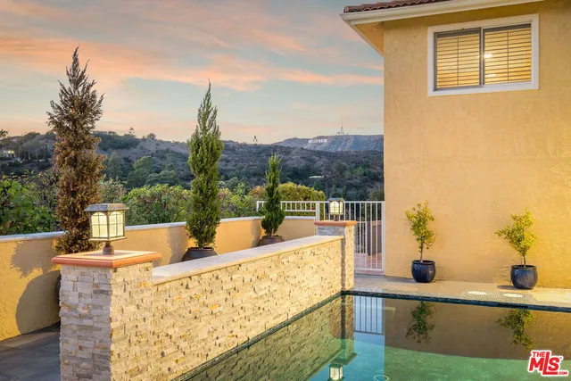a view of swimming pool with a patio
