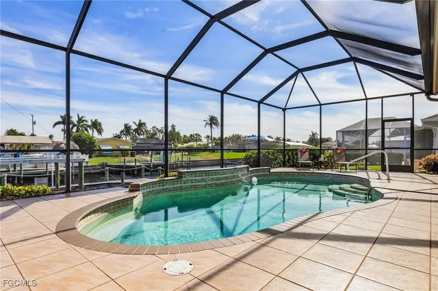 a view of swimming pool with outdoor seating