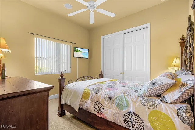 a bedroom with a bed and a table in it