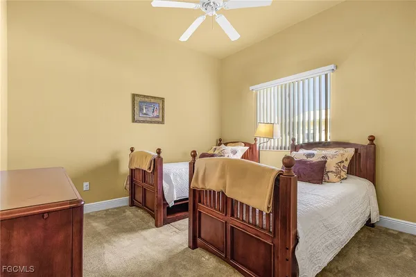 a bed room with a bed and a window