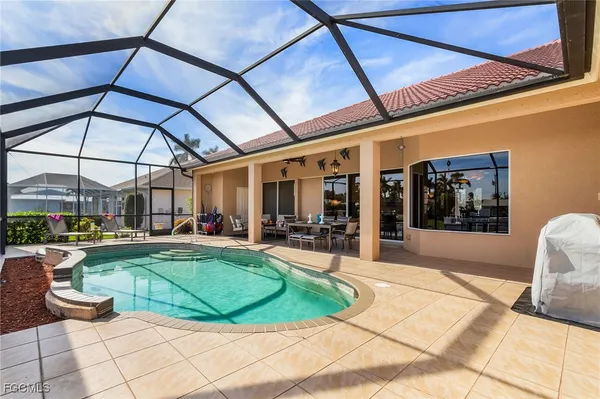 a view of a backyard with sitting area