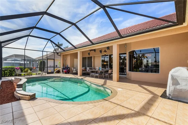 a view of a backyard with sitting area