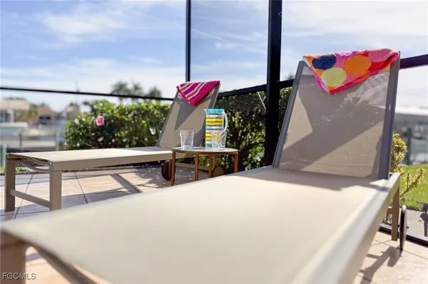 a view of a living room with furniture and window