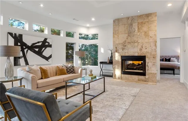 a living room with furniture and a fireplace