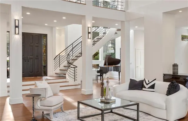 a living room with furniture and a painting