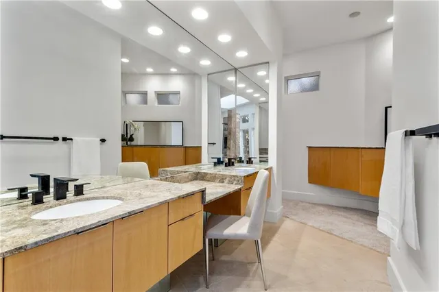 a kitchen with a sink a counter top space and appliances