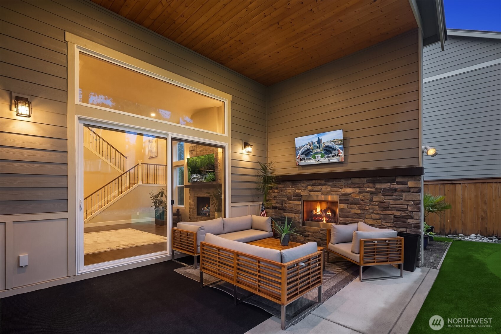1435 242nd Place Southeast Bothell, WA 98021 - Photo 5 of 40 a outdoor living space with patio furniture and a fireplace