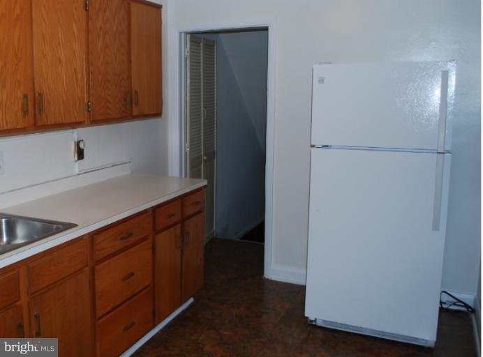 1126 Kevin Road Baltimore, MD 21229 - Photo 1 of 24 a kitchen with stainless steel appliances a refrigerator and a sink