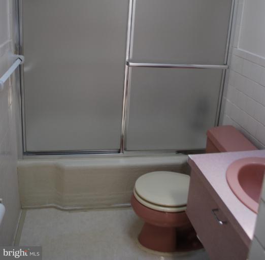 1126 Kevin Road Baltimore, MD 21229 - Photo 2 of 24 a bathroom with a toilet and a sink