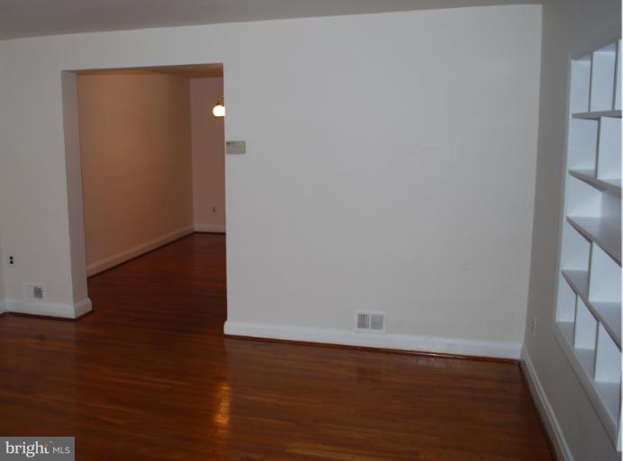 1126 Kevin Road Baltimore, MD 21229 - Photo 15 of 24 an empty room with wooden floor