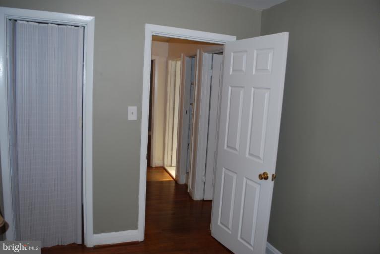 1126 Kevin Road Baltimore, MD 21229 - Photo 3 of 24 a view of a hallway with wooden floor