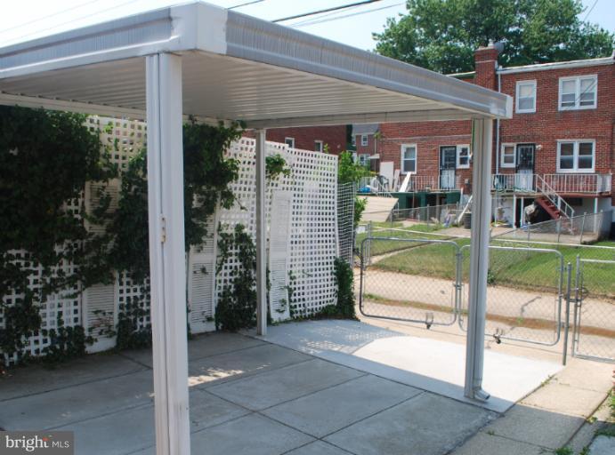 1126 Kevin Road Baltimore, MD 21229 - Photo 23 of 24 a view of a house with backyard and porch