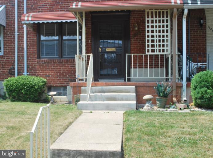 1126 Kevin Road Baltimore, MD 21229 - Photo 24 of 24 a view of a house with a yard and sitting area