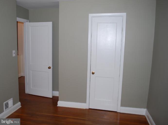 1126 Kevin Road Baltimore, MD 21229 - Photo 9 of 24 a view of empty room with wooden floor