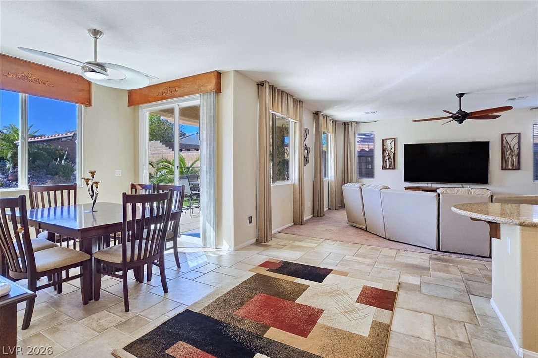 2485 Morrow Ridge Place Laughlin, NV 89029 - Photo 16 of 40 Natural light streams into this versatile open-concept space, perfect for both dining and relaxation.