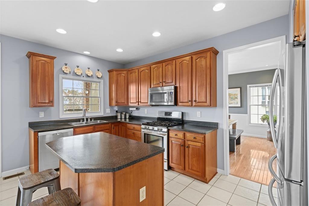 1478 Grandview Way Sewickley, PA 15143 - Photo 12 of 50 a kitchen with a sink stove and cabinets