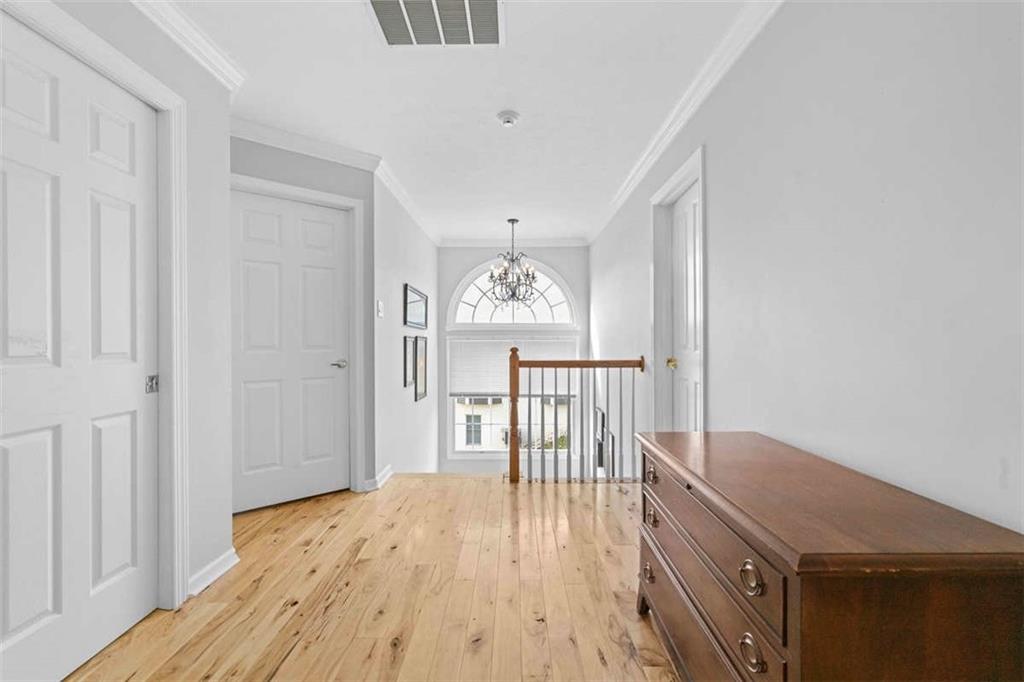 1478 Grandview Way Sewickley, PA 15143 - Photo 20 of 50 a view of a hallway with wooden floor and stairs