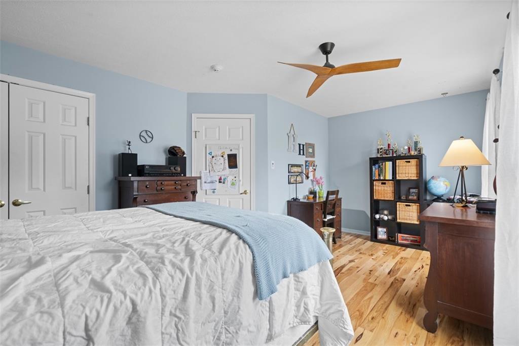 1478 Grandview Way Sewickley, PA 15143 - Photo 33 of 50 a bedroom with a bed and a chandelier