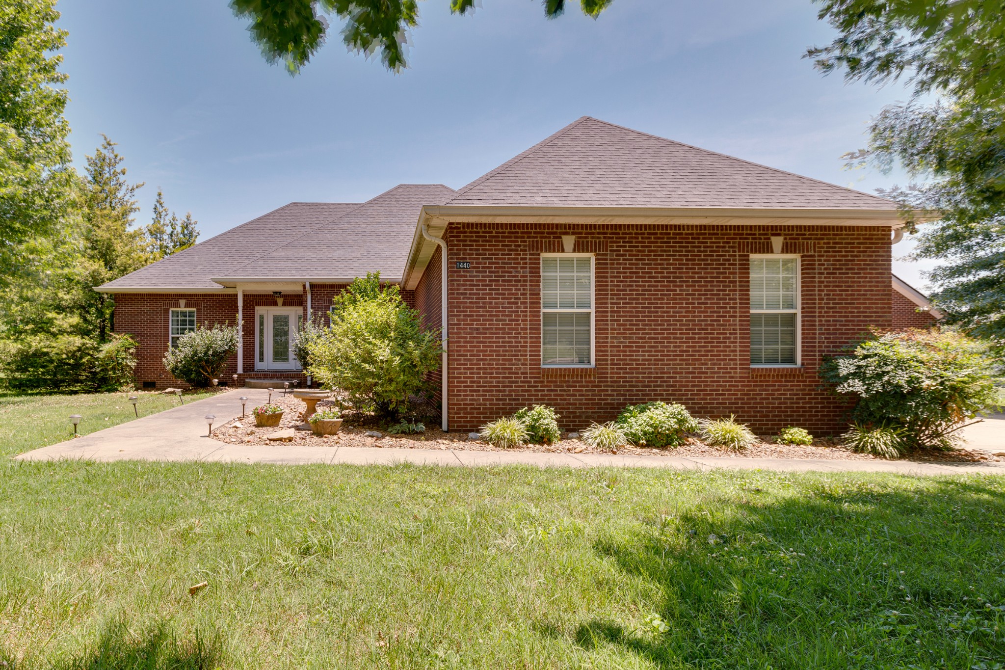 1440 Dudley Road Clarksville, TN 37043 - Photo 8 of 43 a front view of a house with a yard