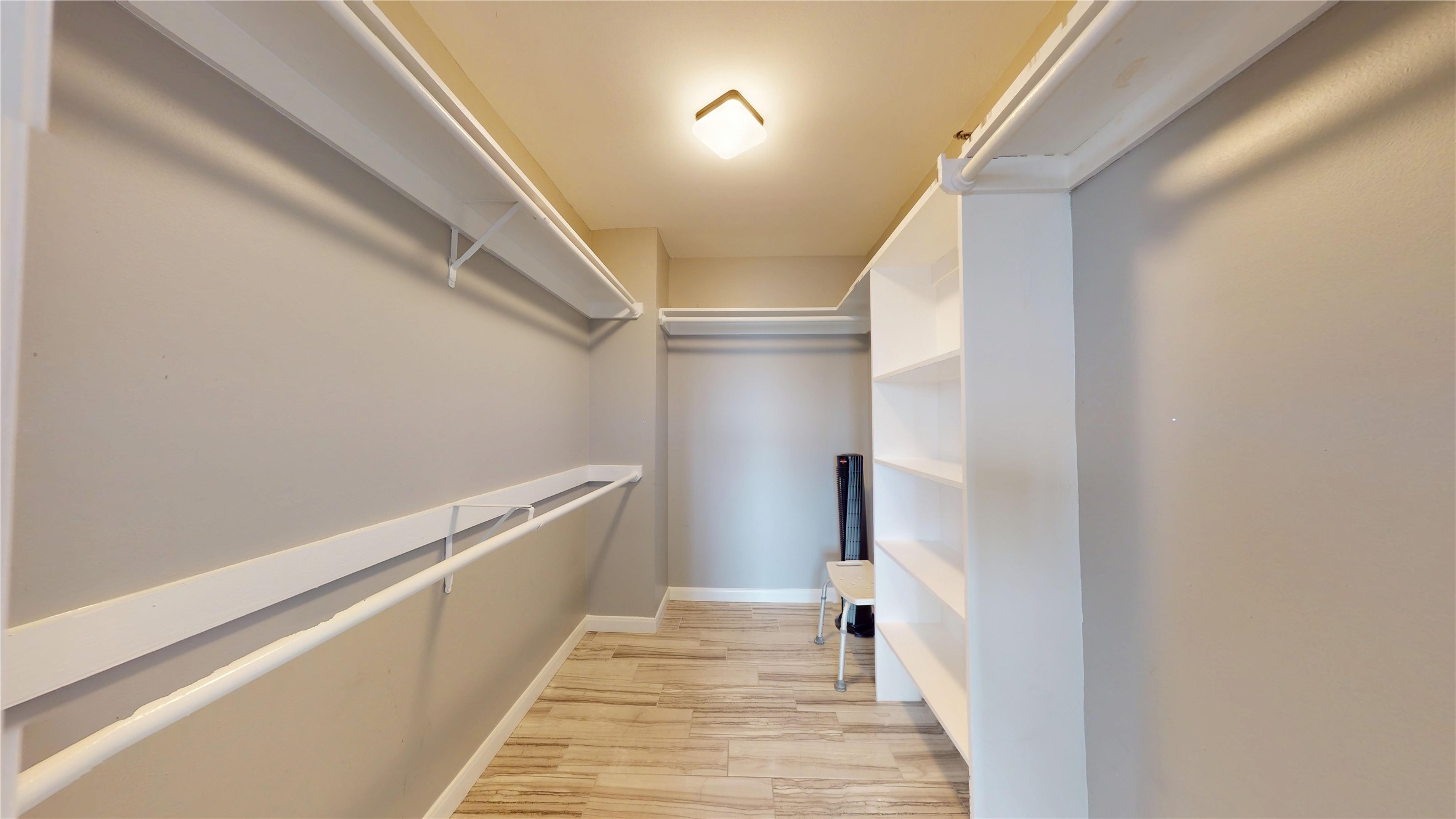 3525 Sage Road, Unit 1404 Houston, TX 77056 - Photo 11 of 36 a hallway with white cabinets and wooden floor