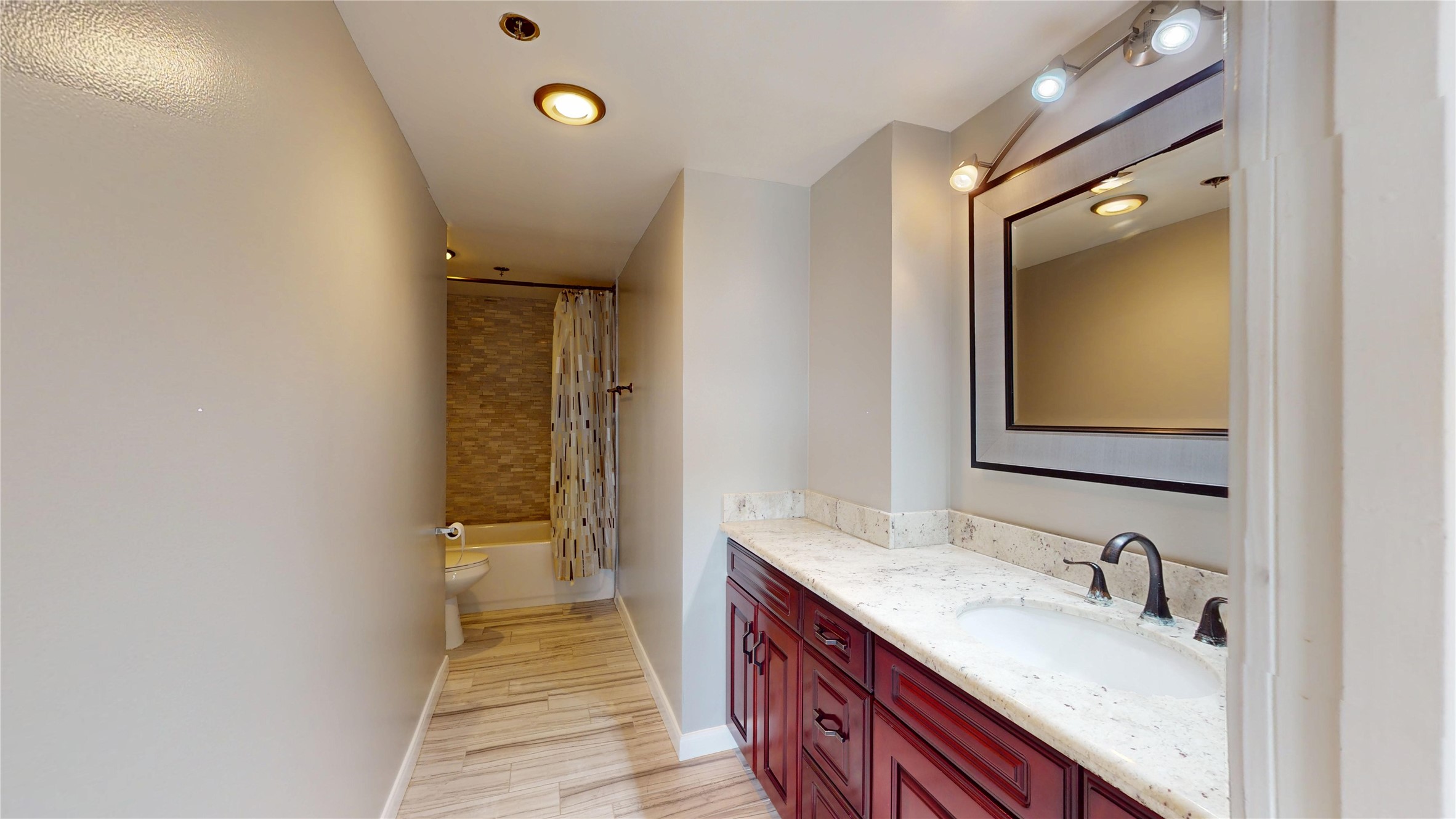 3525 Sage Road, Unit 1404 Houston, TX 77056 - Photo 12 of 36 a bathroom with a granite countertop sink and a mirror