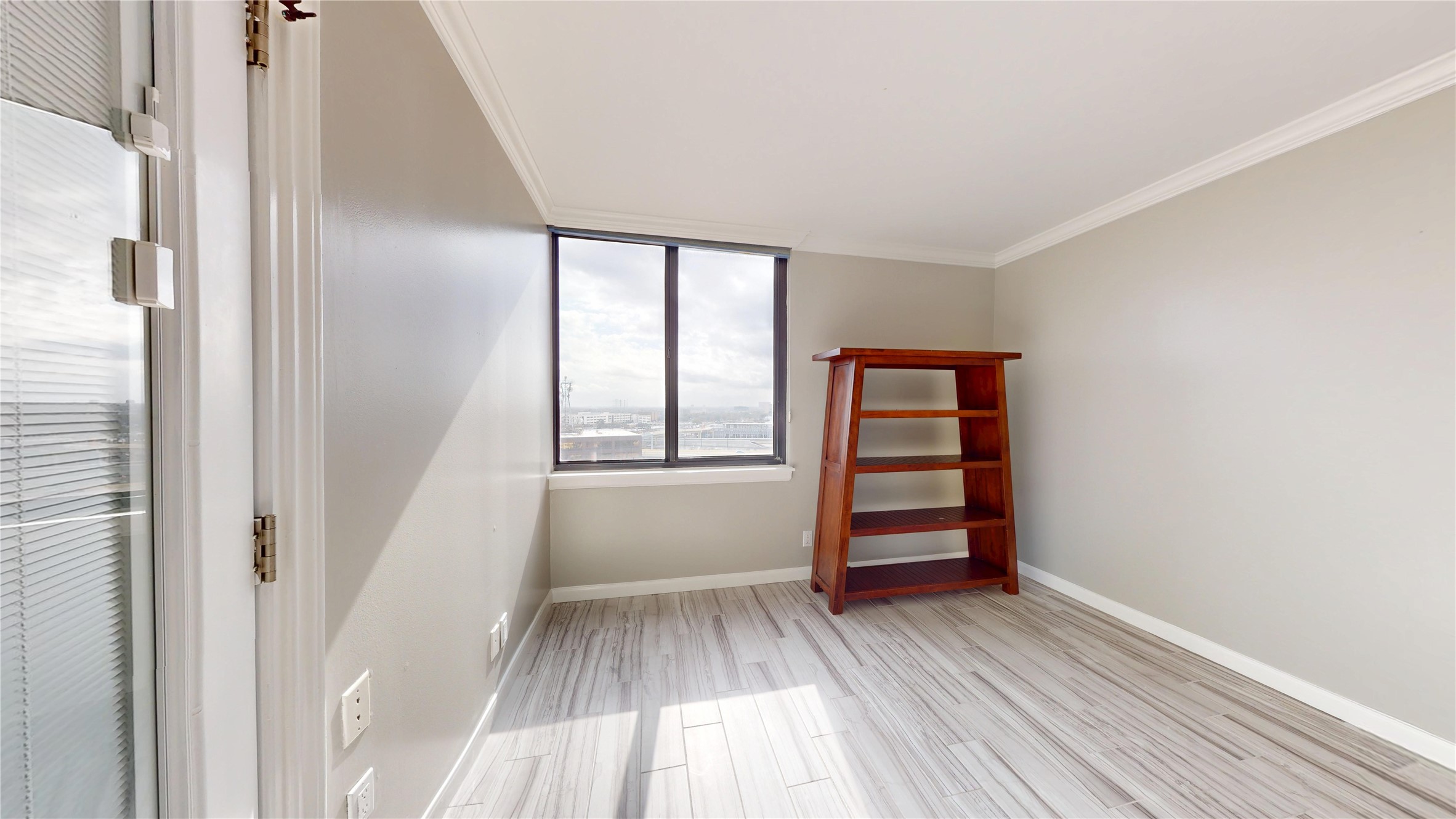 3525 Sage Road, Unit 1404 Houston, TX 77056 - Photo 14 of 36 wooden floor in an empty room with a window