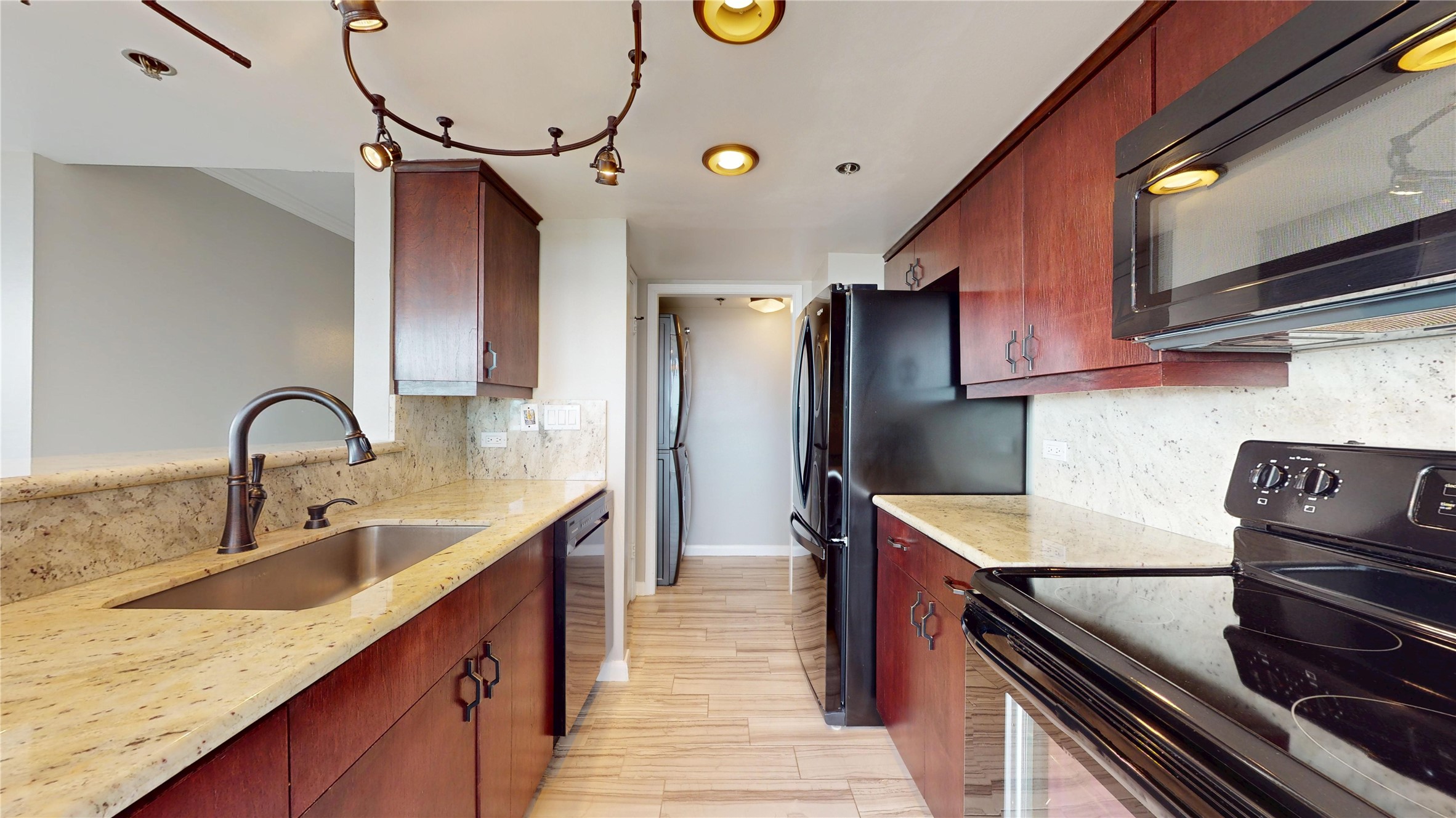 3525 Sage Road, Unit 1404 Houston, TX 77056 - Photo 18 of 36 a kitchen with stainless steel appliances granite countertop a sink stove and refrigerator
