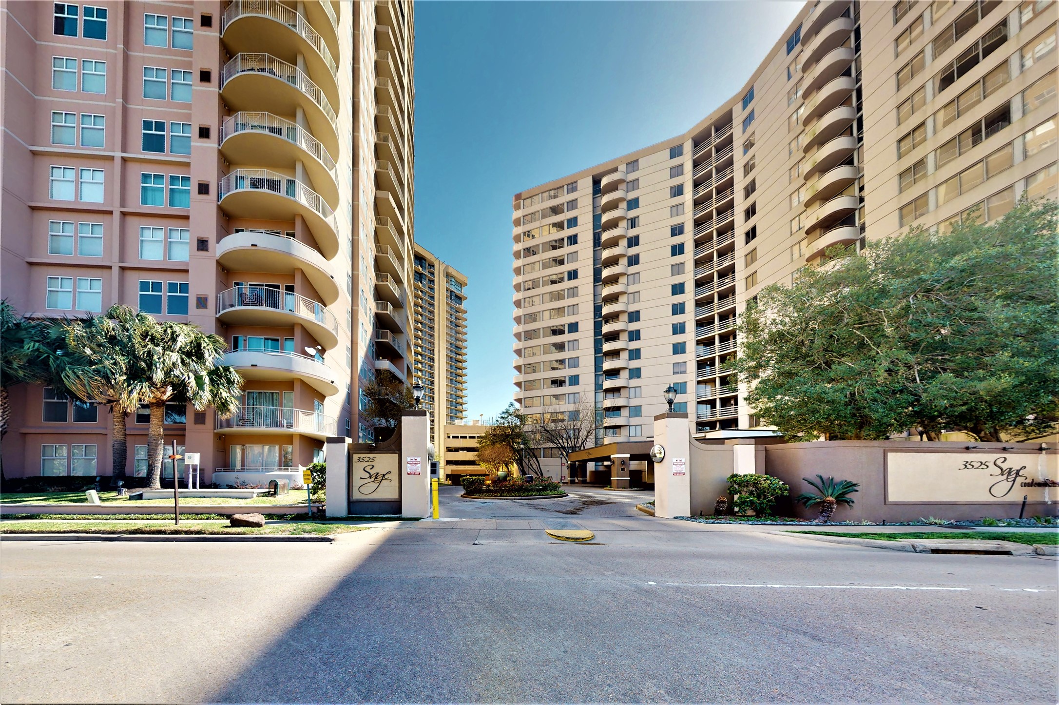 3525 Sage Road, Unit 1404 Houston, TX 77056 - Photo 2 of 36 a front view of a multi story residential apartment building with yard