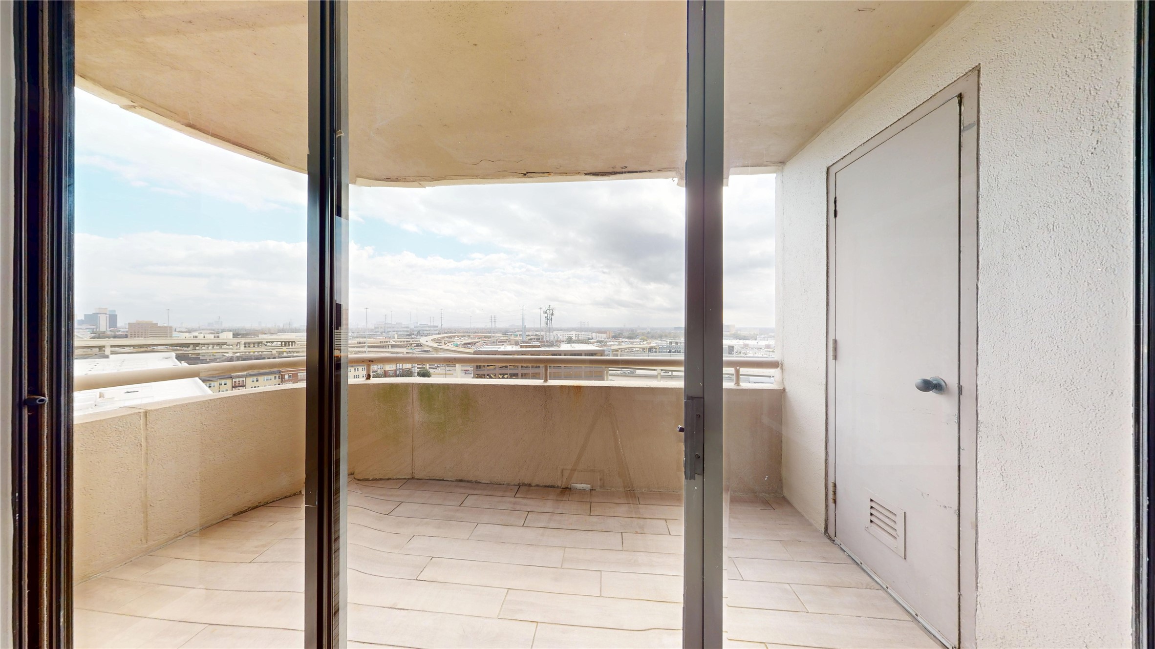3525 Sage Road, Unit 1404 Houston, TX 77056 - Photo 24 of 36 a view of a glass door and a window