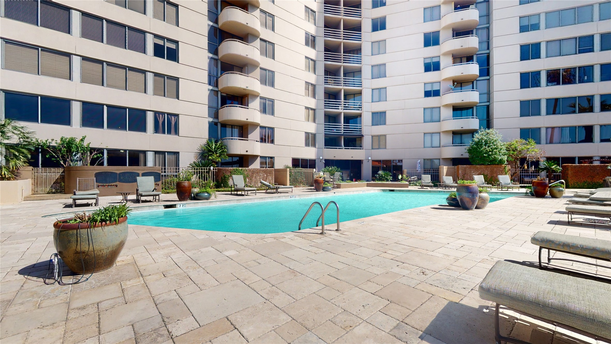 3525 Sage Road, Unit 1404 Houston, TX 77056 - Photo 34 of 36 a view of a building with garden and trees