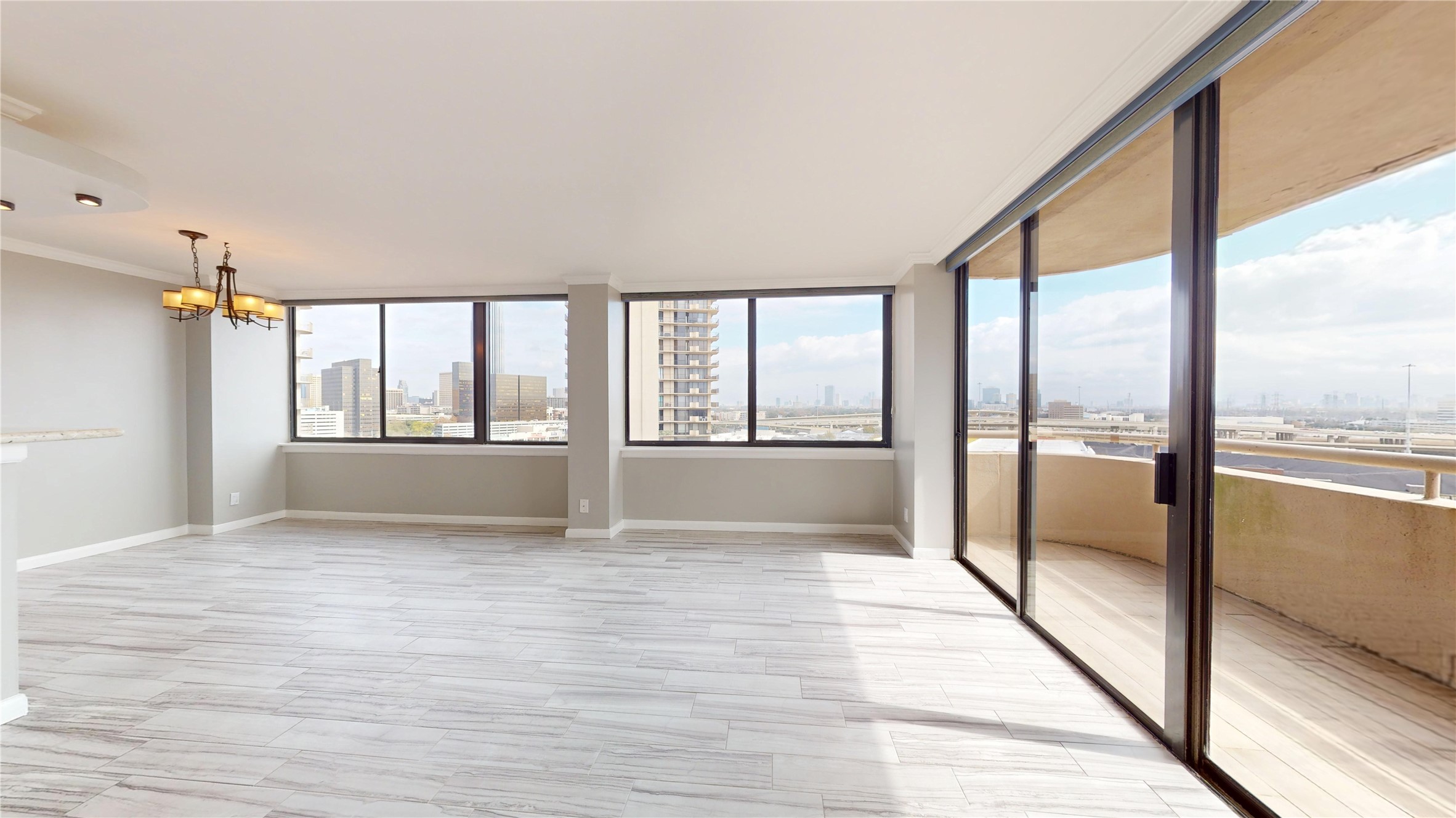 3525 Sage Road, Unit 1404 Houston, TX 77056 - Photo 4 of 36 a view of an empty room with a window