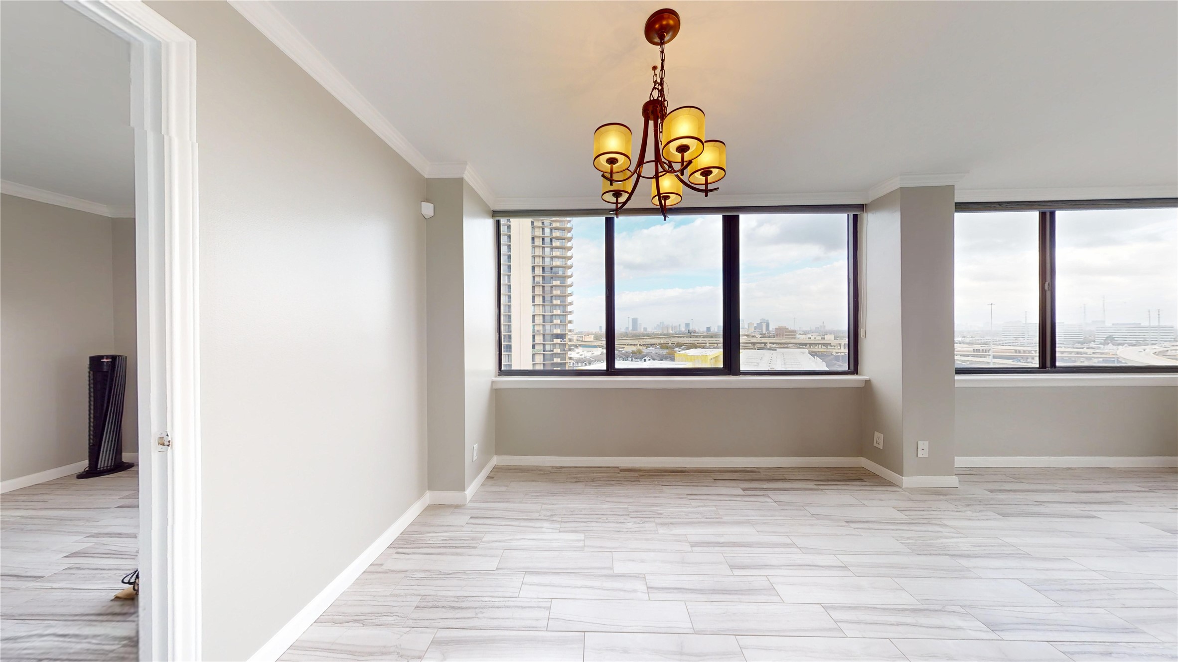 3525 Sage Road, Unit 1404 Houston, TX 77056 - Photo 7 of 36 a view of hallway with wooden floor and a window