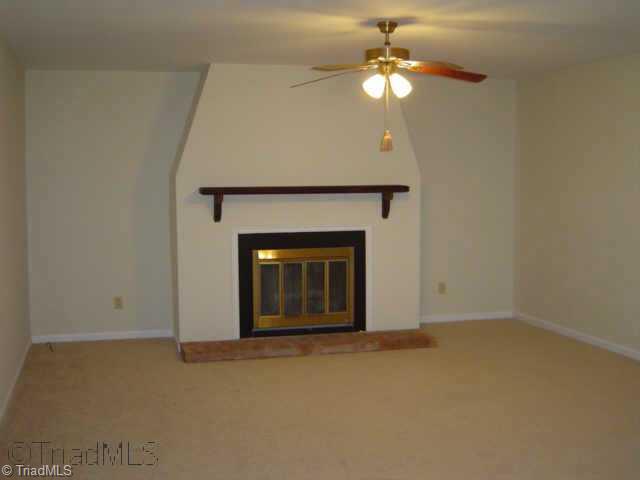 146 Old Mill Road, Unit C High Point, NC 27265 - Photo 4 of 9 Other. living room with fireplace and sliding door opens to covered deck