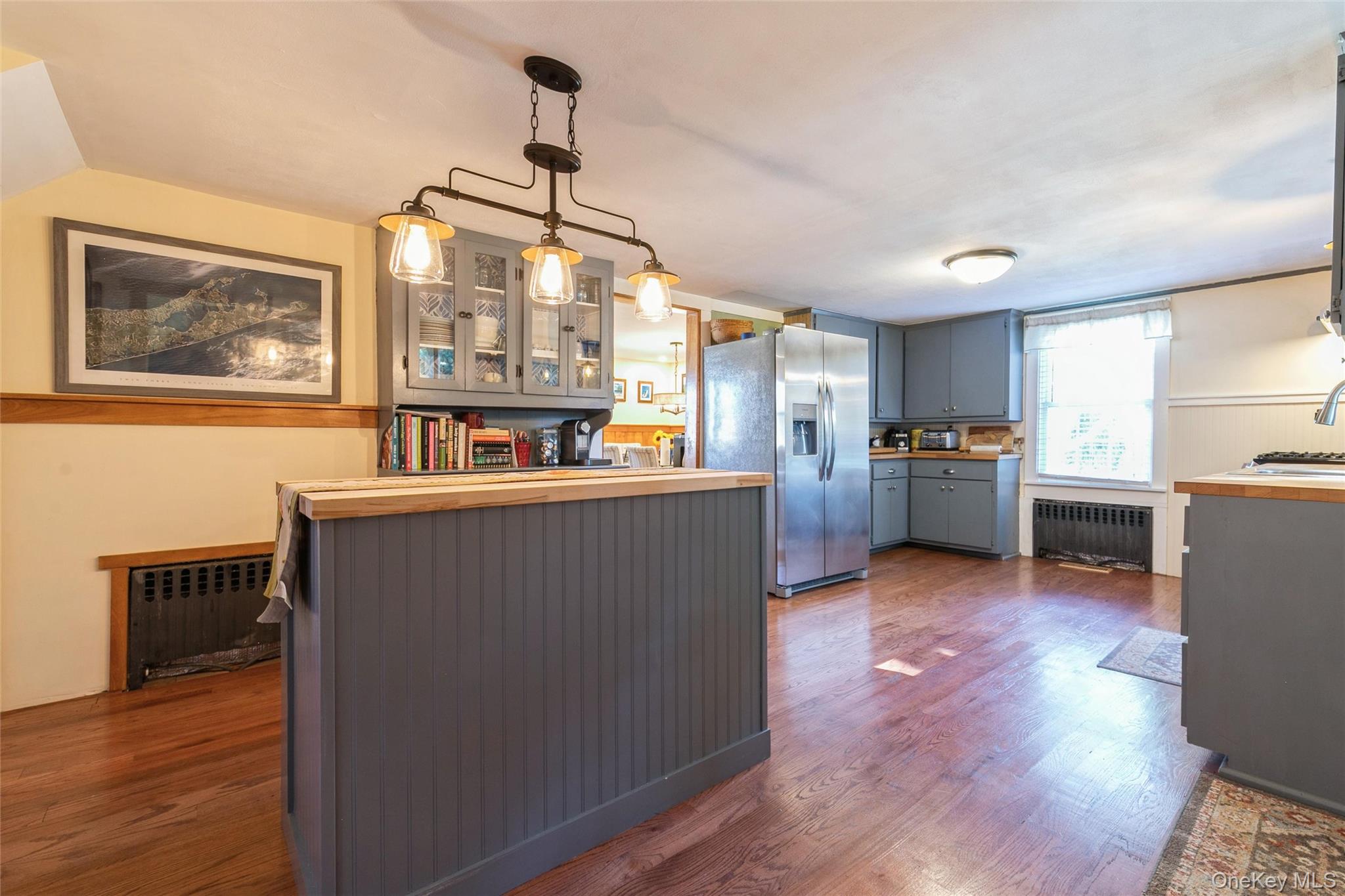 240 Wicks Road New Suffolk, NY 11956 - Photo 13 of 36 a living room with furniture and a wooden floor
