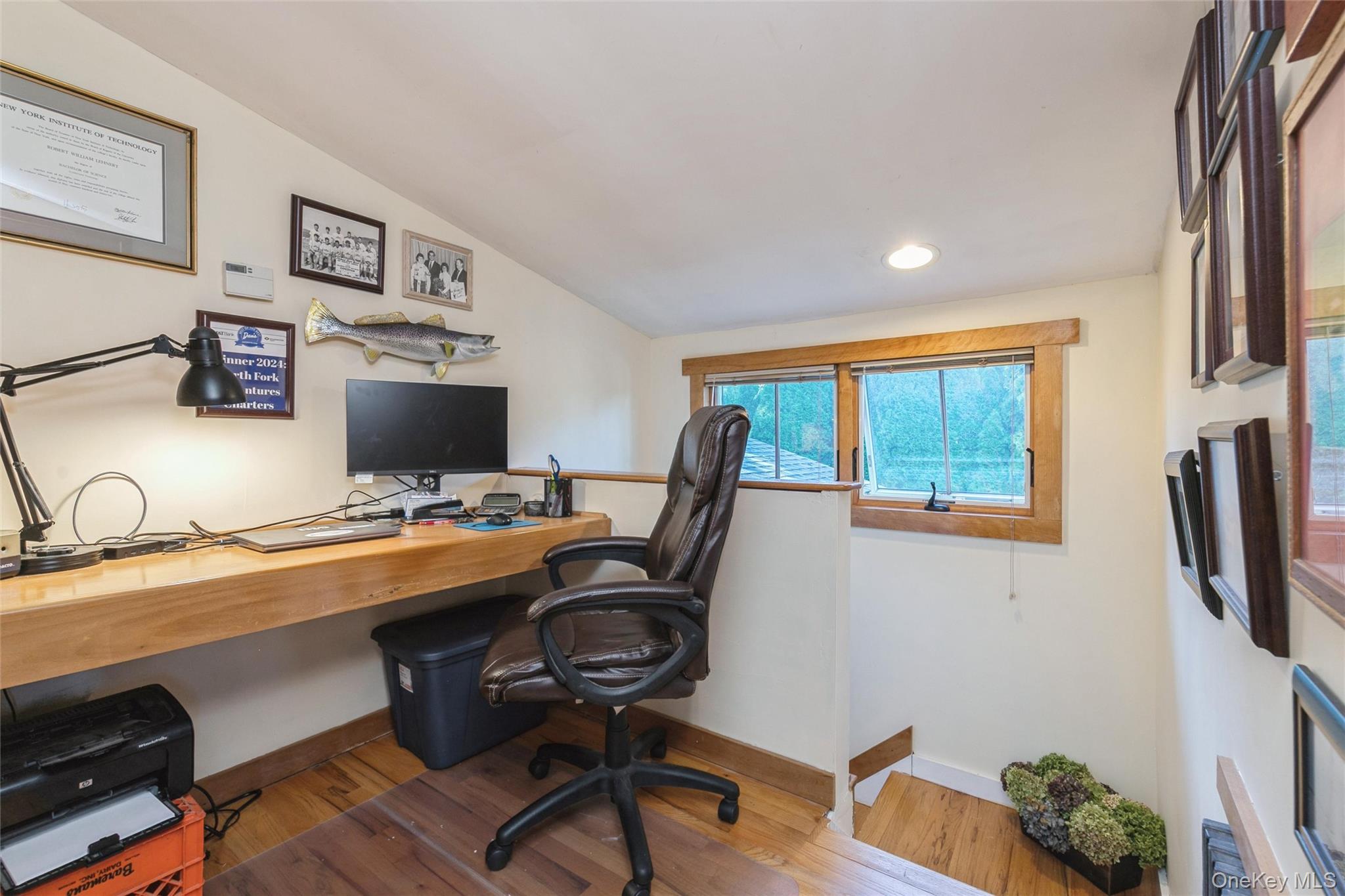 240 Wicks Road New Suffolk, NY 11956 - Photo 20 of 36 a view of a workspace with furniture and a window