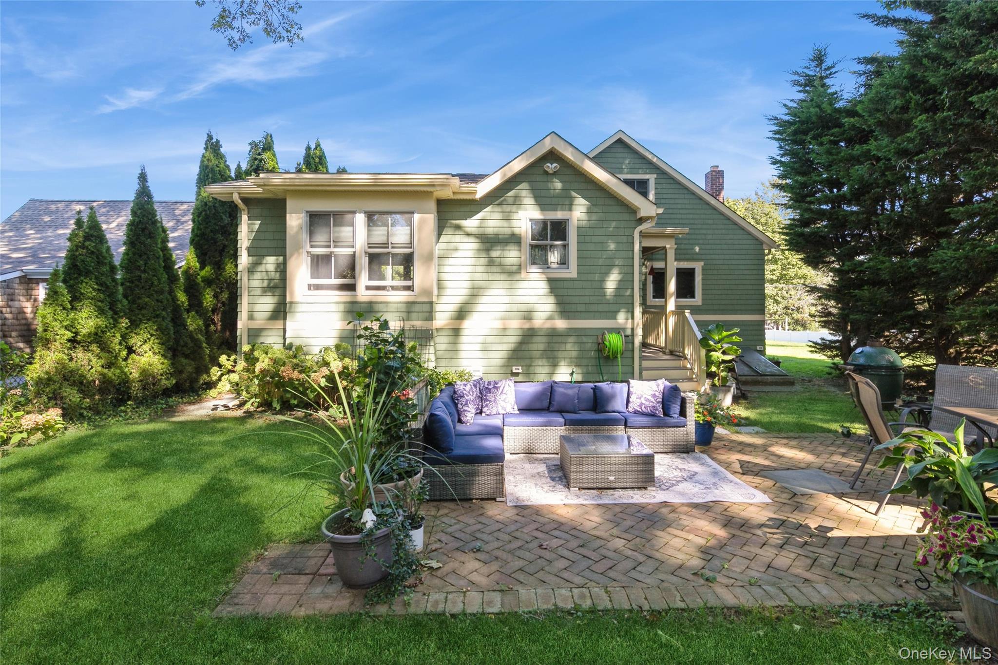 240 Wicks Road New Suffolk, NY 11956 - Photo 24 of 36 a front view of a house with a yard
