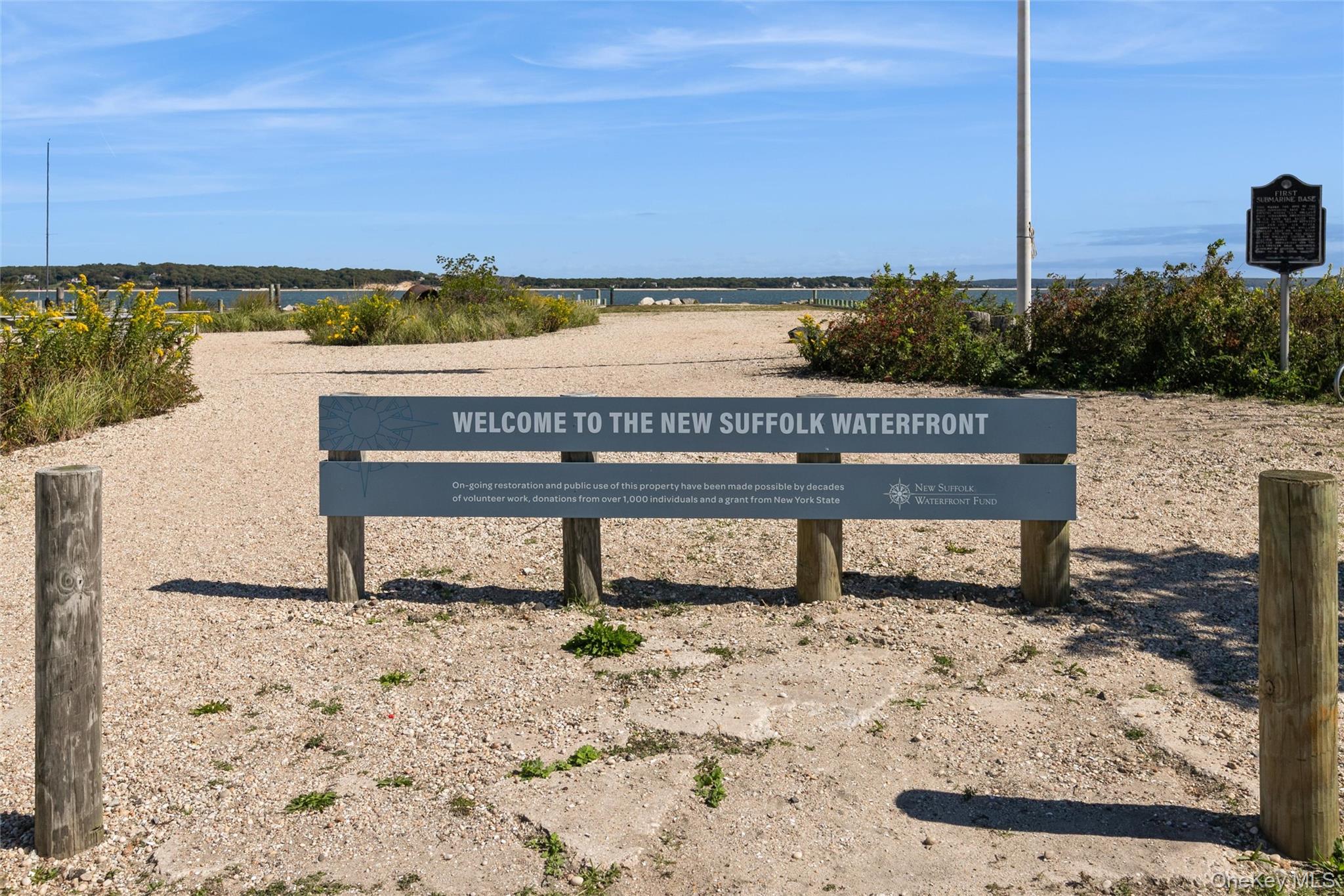 240 Wicks Road New Suffolk, NY 11956 - Photo 30 of 36 a view of a terrace with a bench