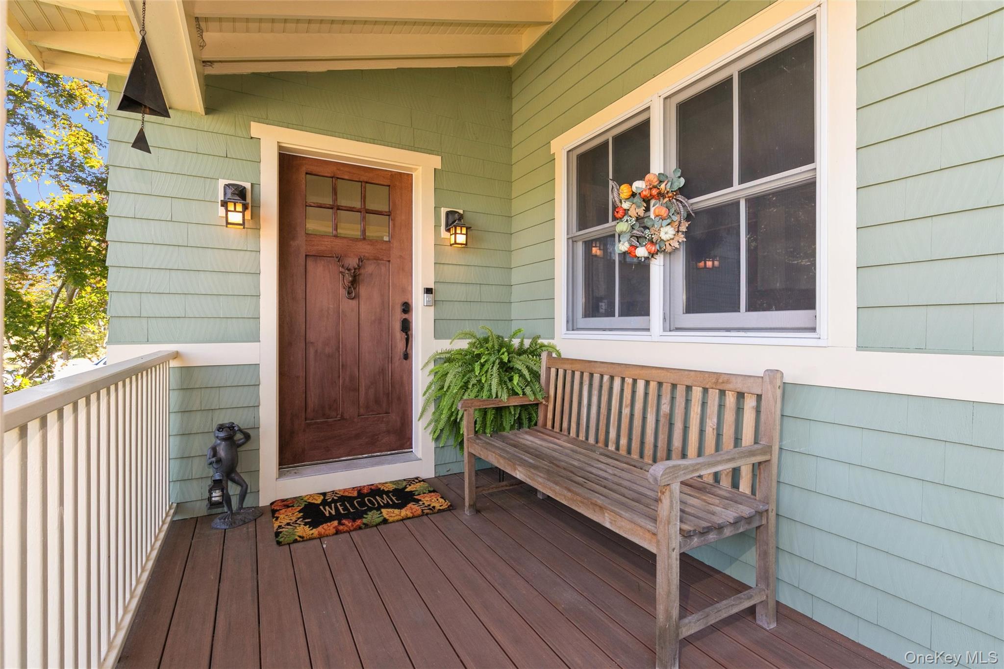 240 Wicks Road New Suffolk, NY 11956 - Photo 4 of 36 a view of deck with a chair and floor to ceiling window