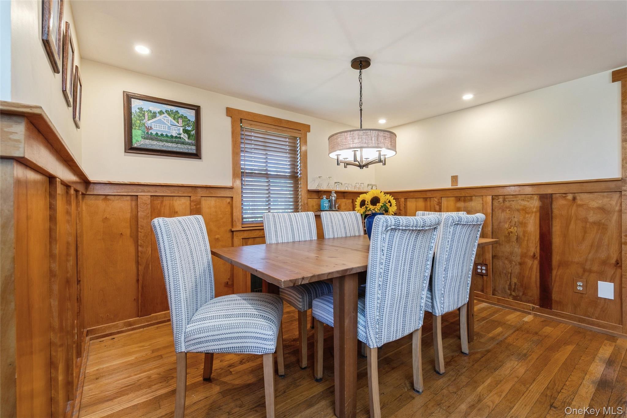 240 Wicks Road New Suffolk, NY 11956 - Photo 8 of 36 a view of a dining room with furniture wooden floor and chandelier