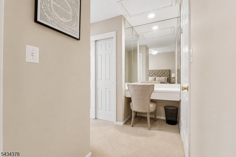 606 Park Place Springfield, NJ 07081 - Photo 14 of 21 a room with a table and chairs