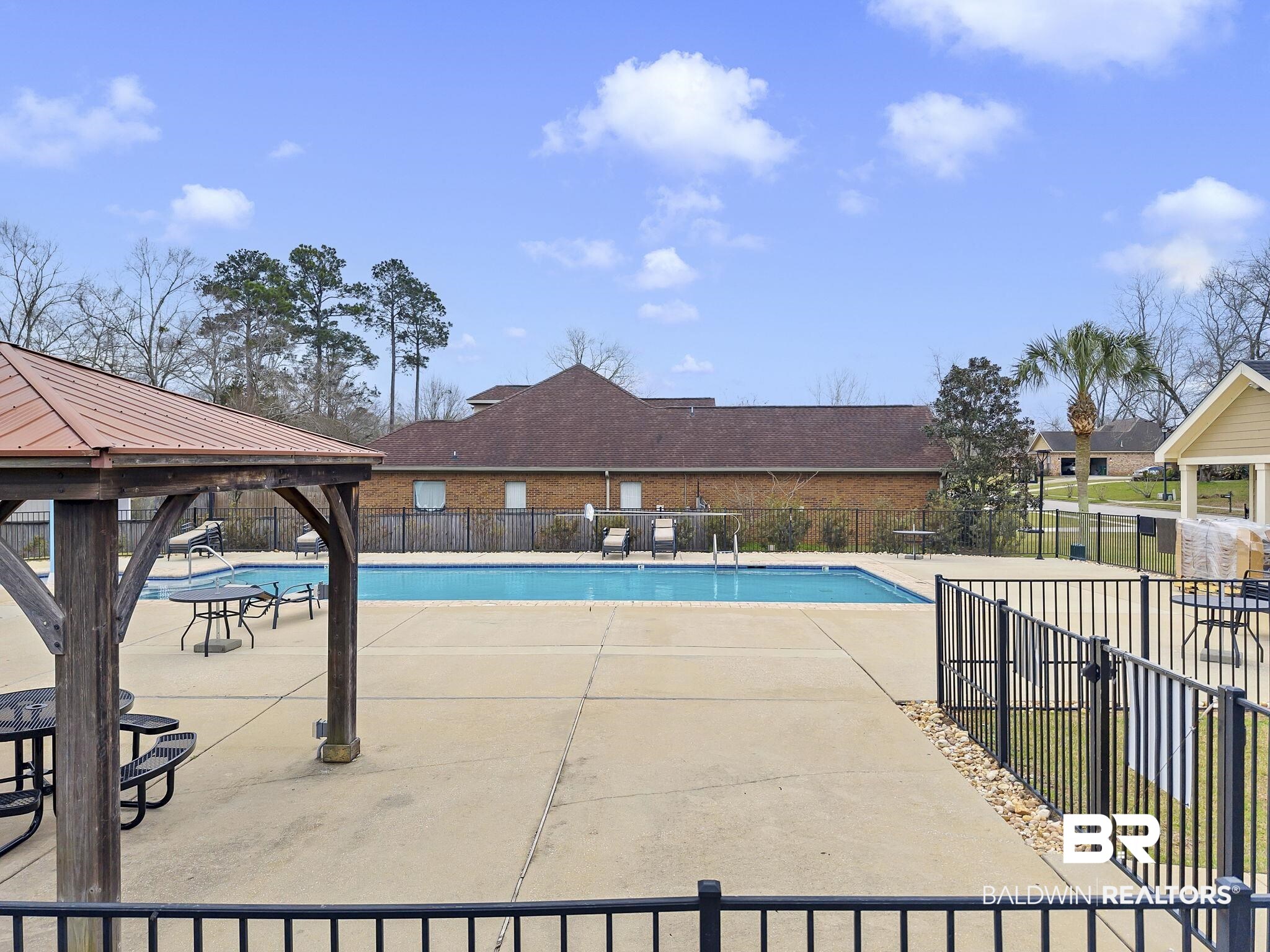 11247 Thistledown Loop Spanish Fort, AL 36527 - Photo 59 of 72 Community pool featuring a patio area, fence, and a gazebo