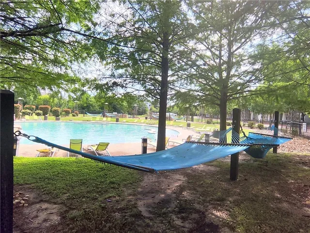 a living room with fireplace furniture and a flat screen tv