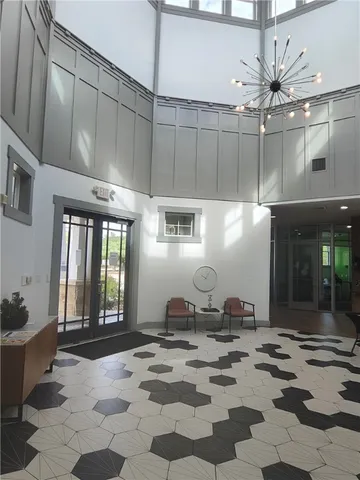 a living room with furniture and kitchen view