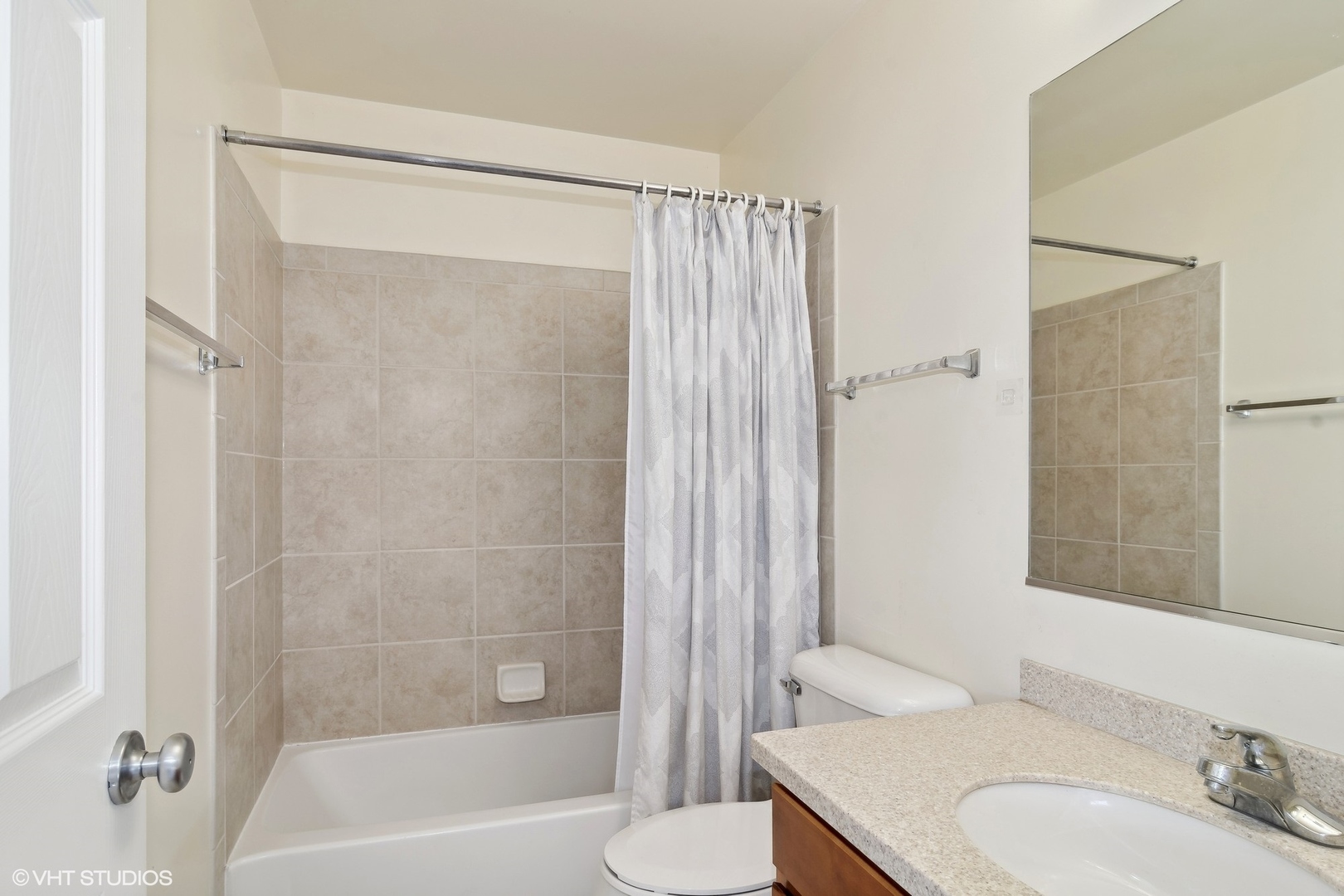 318 Emerald Drive Streamwood, IL 60107 - Photo 12 of 19 a bathroom with a granite countertop bathtub shower sink vanity and toilet