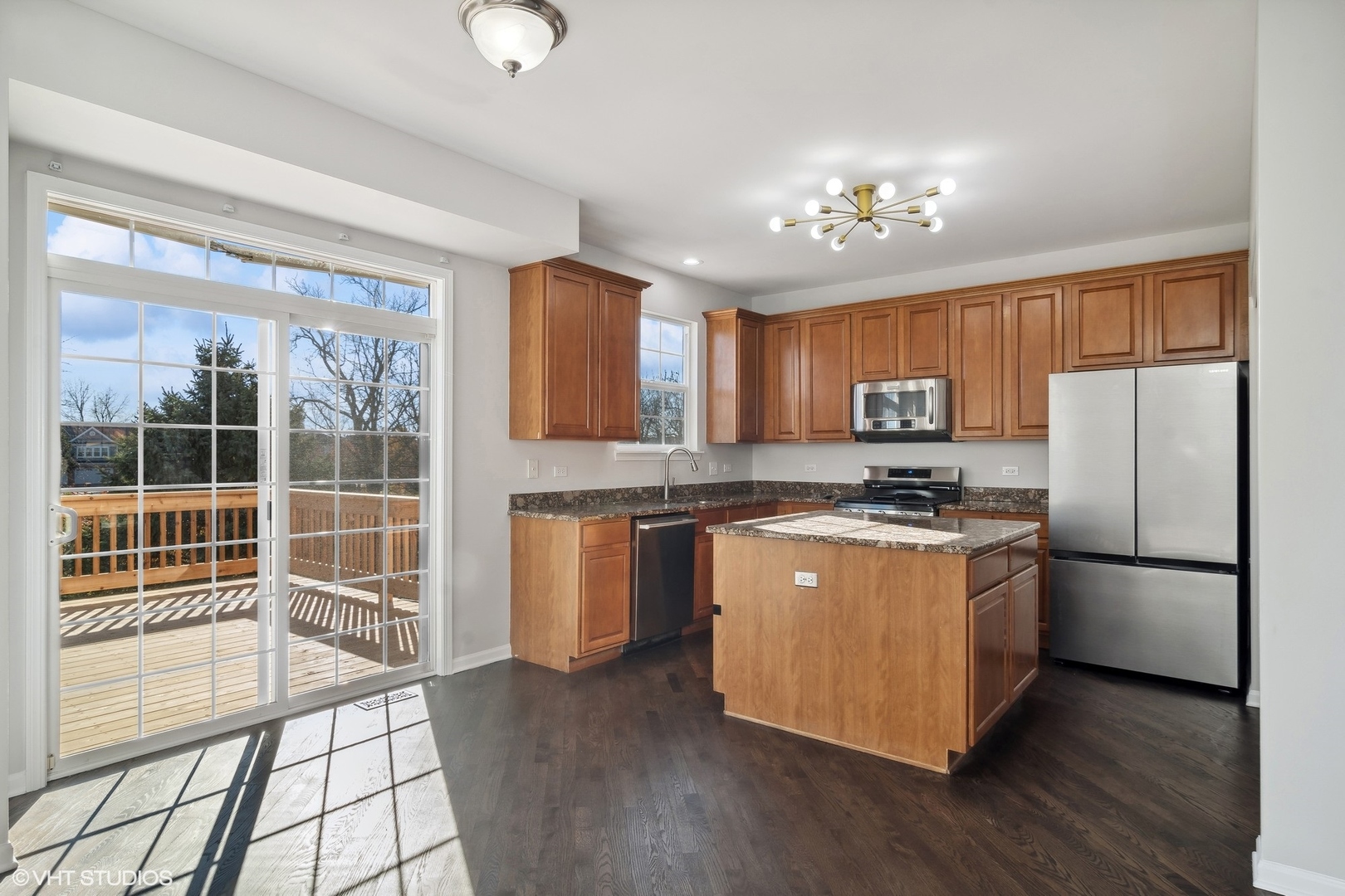 318 Emerald Drive Streamwood, IL 60107 - Photo 4 of 19 a kitchen with stainless steel appliances granite countertop a refrigerator a stove a sink dishwasher a oven with white cabinets and wooden floor