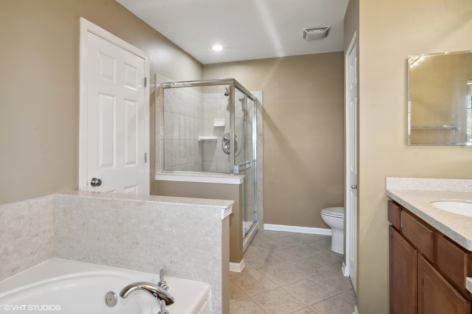 318 Emerald Drive Streamwood, IL 60107 - Photo 10 of 19 a bathroom with a sink a toilet and shower