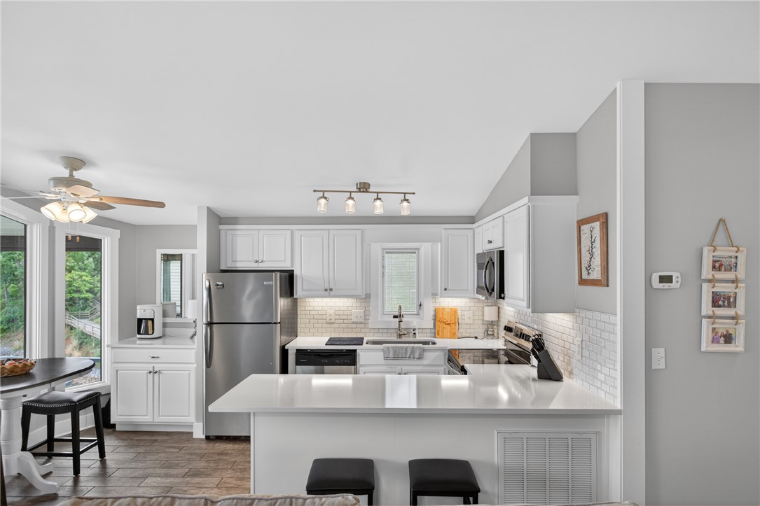 1230 Melton Road, Unit 4 West Union, SC 29696 - Photo 36 of 48 A well-appointed kitchen features sleek countertops and modern appliances, creating a pristine culinary space.